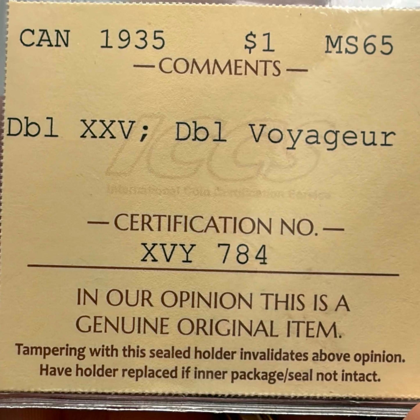 ICCS certification label — 1935 Canadian $1 MS-65 Dbl XXV; Dbl Voyageur, Cert No. XVY 784