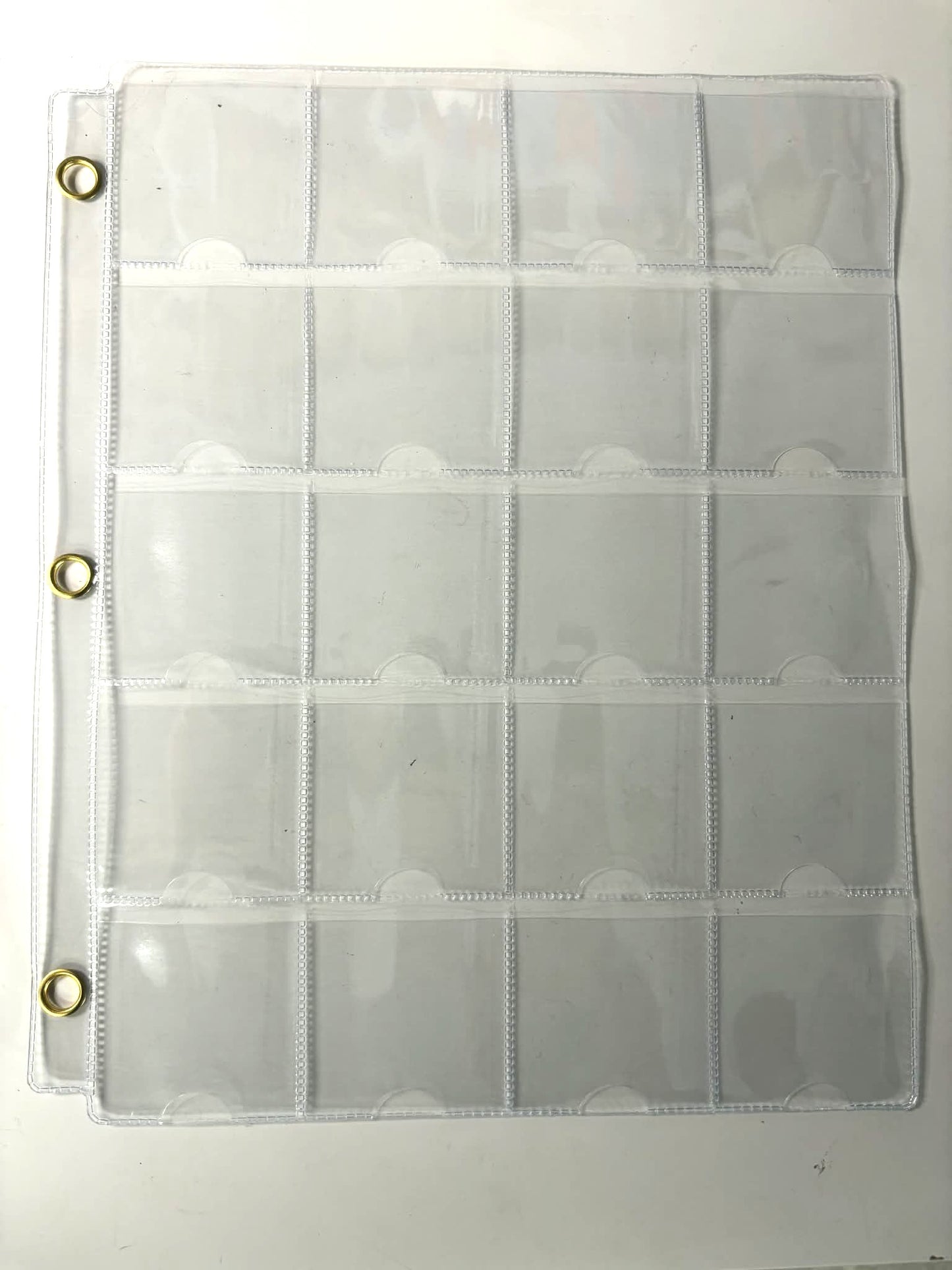 20 pocket pages with metal eye reinforcement strips (individual sheets)