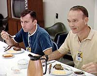 Astronauts Young and Collins at breakfast