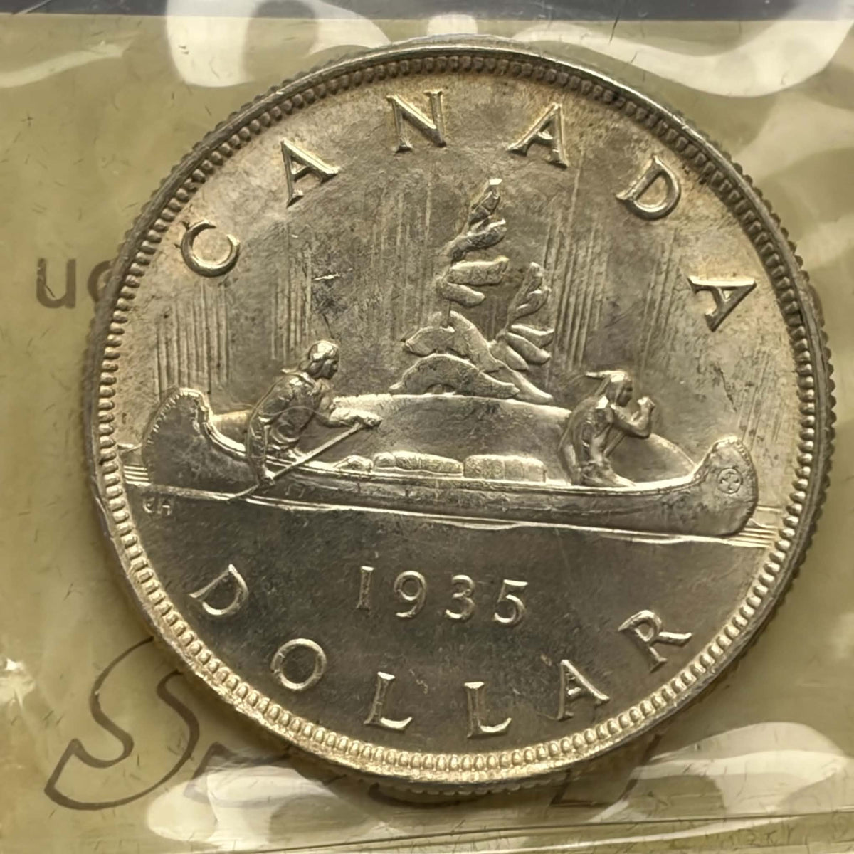 1935 Canadian silver dollar Voyageur canoe reverse