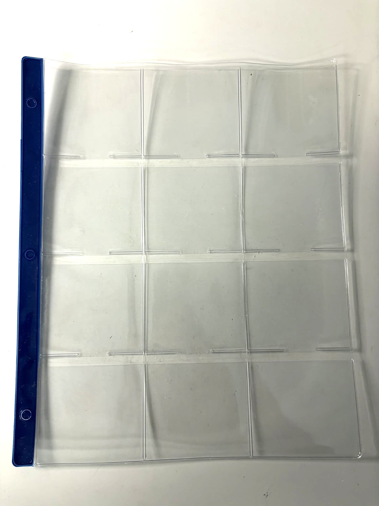 12 pocket pages with blue reinforcement strips (individual sheets) for ICCS Coins