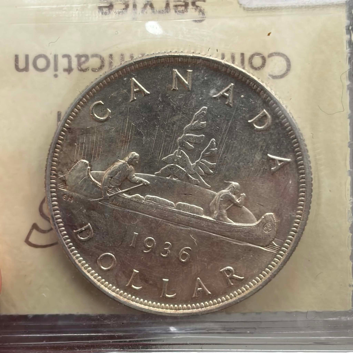 1936 Canadian Silver Dollar — reverse showing Voyageur canoe design 1936 DOLLAR in ICCS holder
