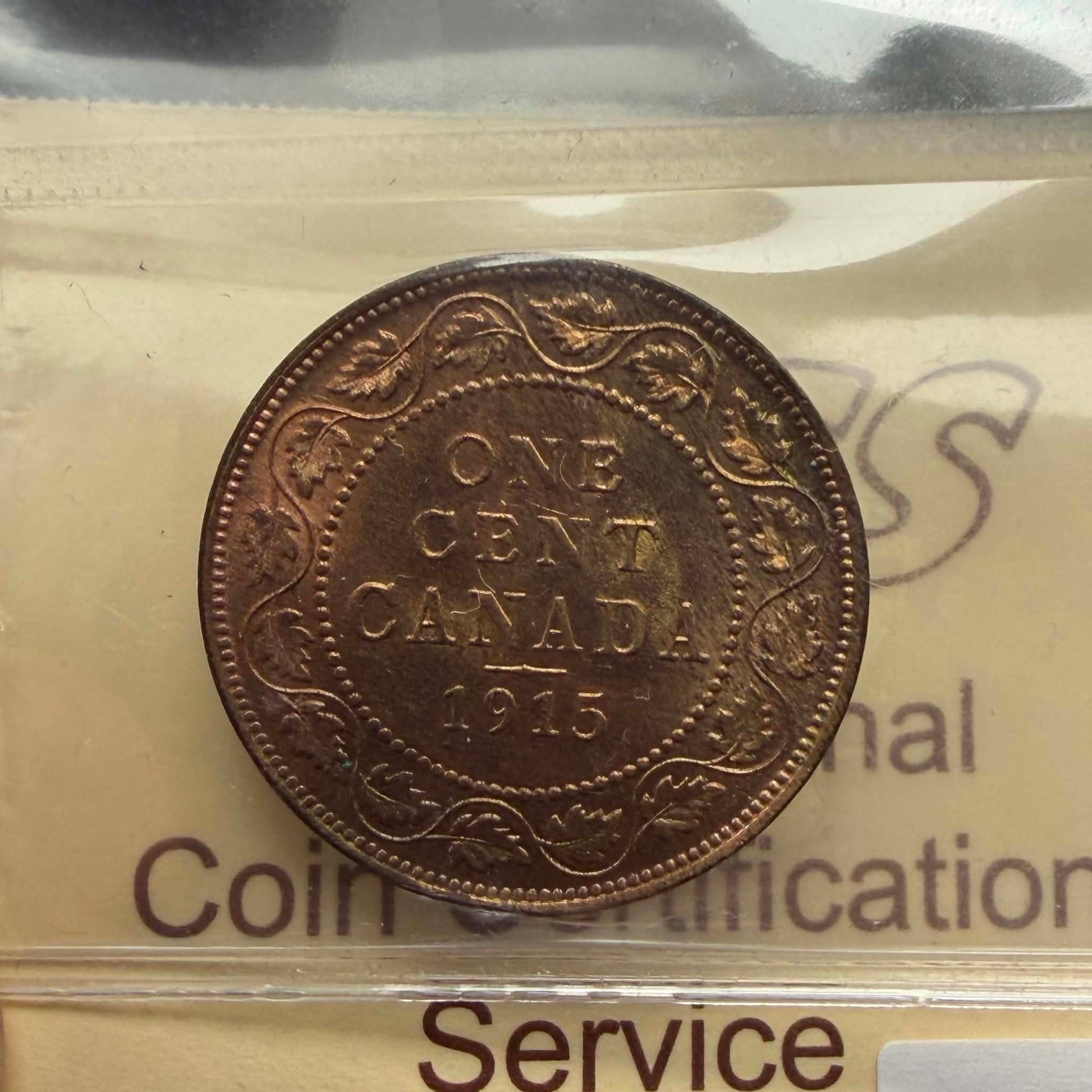 1915 Canadian 1 Cent — reverse showing ONE CENT CANADA 1915 maple wreath in ICCS holder