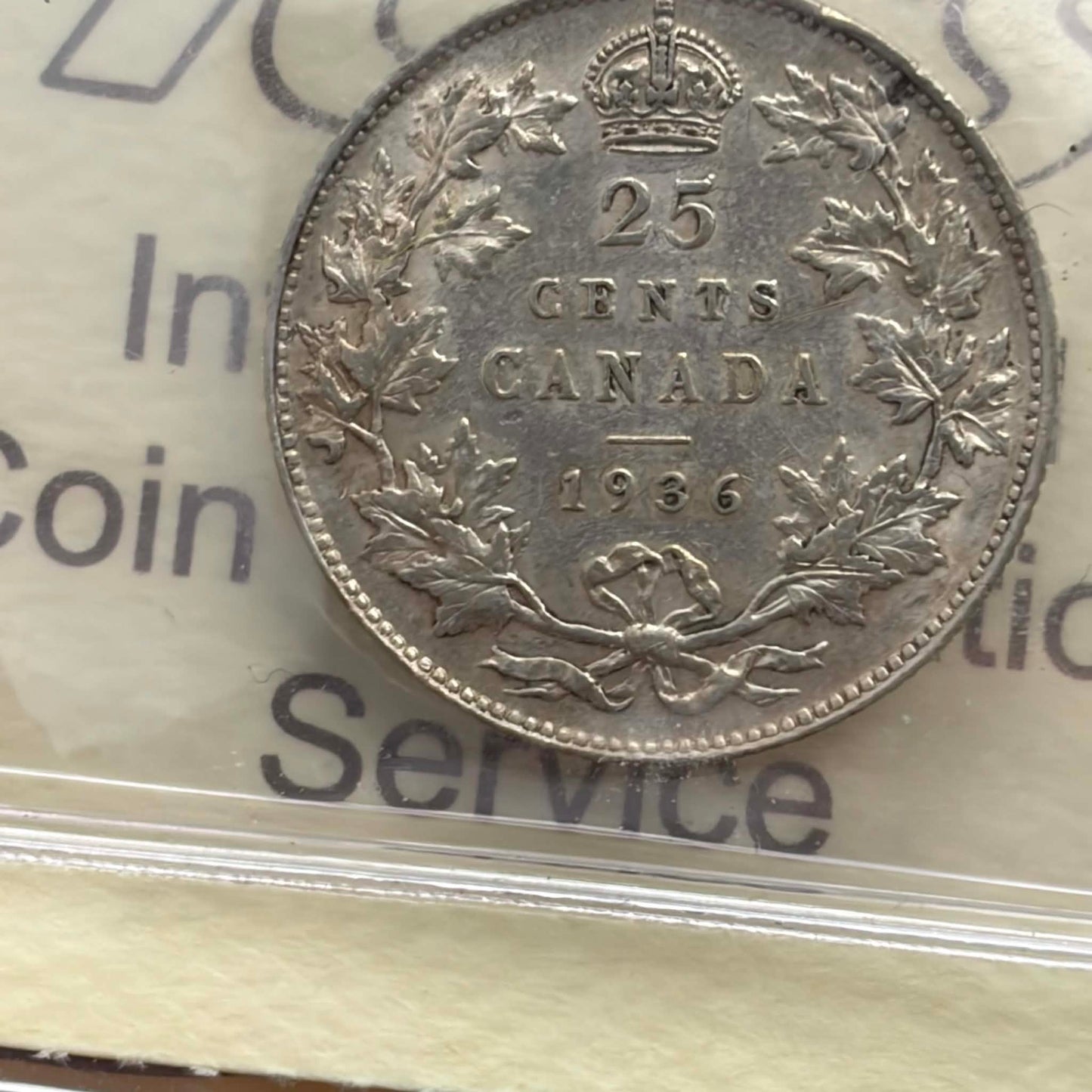 1936 Canadian 25 Cents — reverse showing 25 CENTS CANADA 1936 maple wreath in ICCS holder