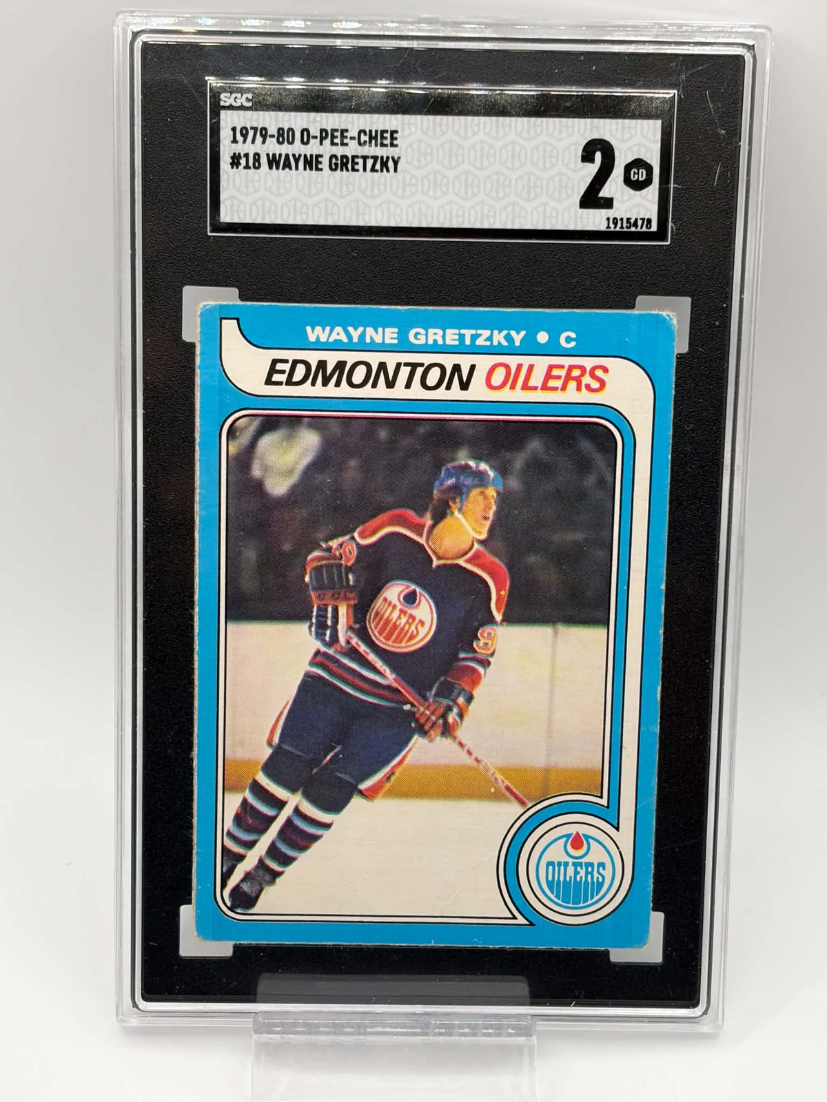 1979-80 O-Pee-Chee #18 Wayne Gretzky rookie card front in SGC 2 Good holder, certification 1915478