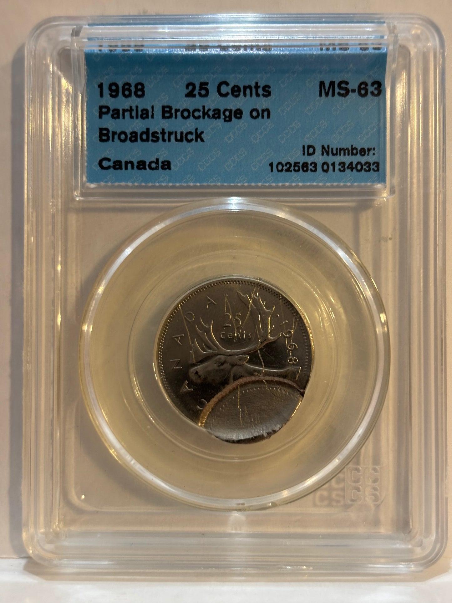 1968 Canada 25 Cents Error. Partial Brokage on Broadstruck. CCCS graded MS63