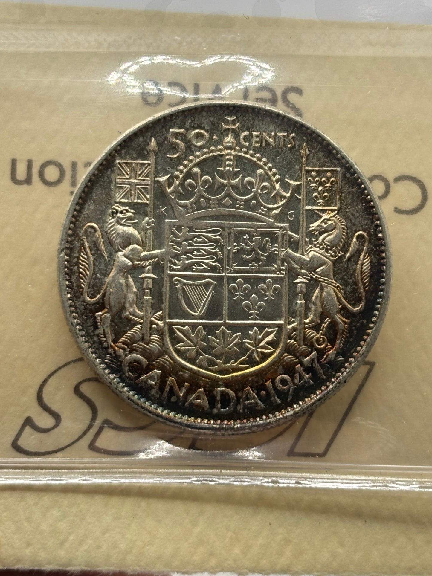 1947 Canada 50 Cents Curved Right 7, ICCS graded AU55