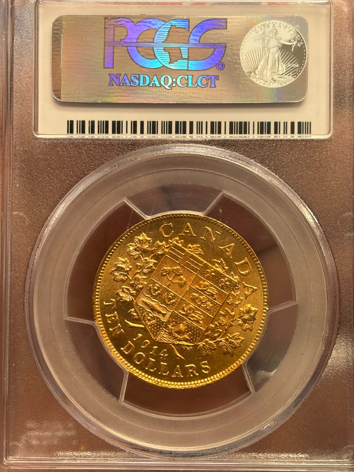 1914 Canadian ten-dollar gold coin George V obverse in PCGS MS63+ Canadian Gold Reserve holder, certification 27163152