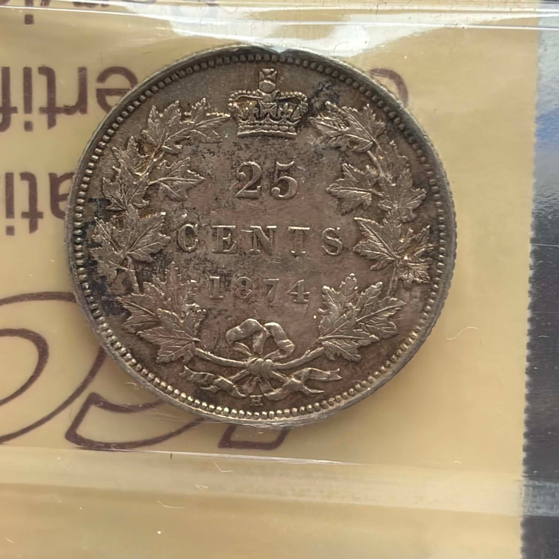 1874H Canadian 25 Cents — reverse showing 25 CENTS 1874 maple wreath in ICCS holder