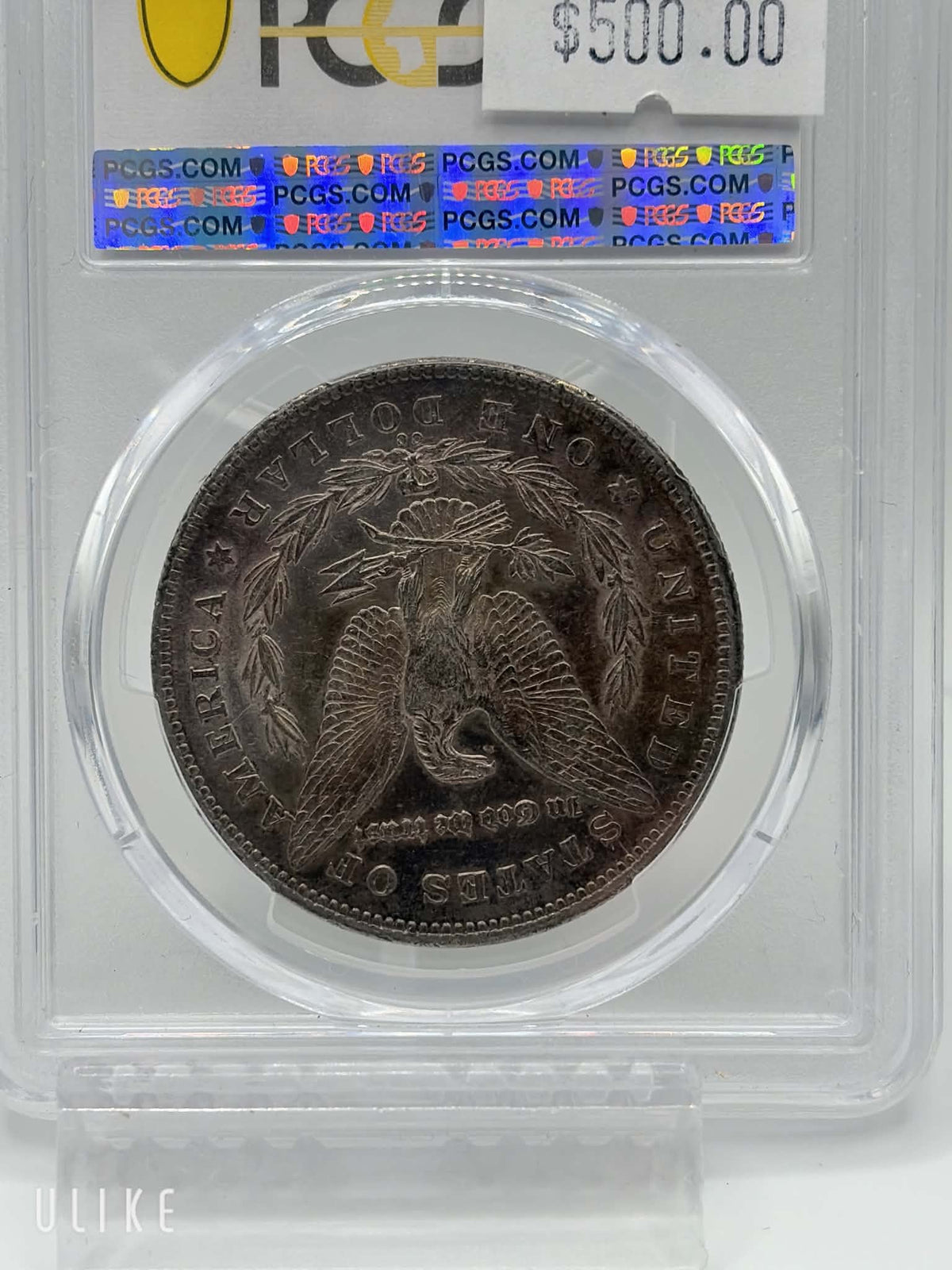 1878-CC Morgan Dollar — reverse showing heraldic eagle and CC mintmark with original toning in PCGS holder, AU-55