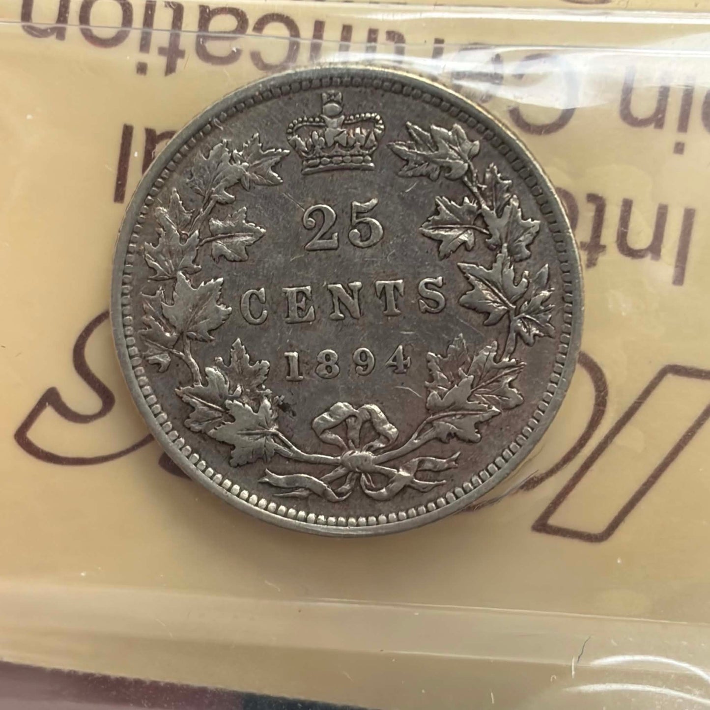 1894 Canadian 25 Cents — reverse showing 25 CENTS maple wreath 1894 in ICCS holder