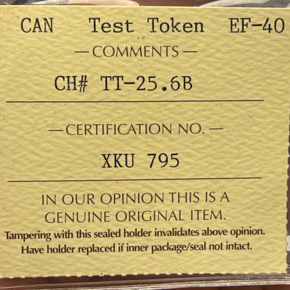Opposite face of 1965 Canadian test token CH TT-25.6B with flying bird